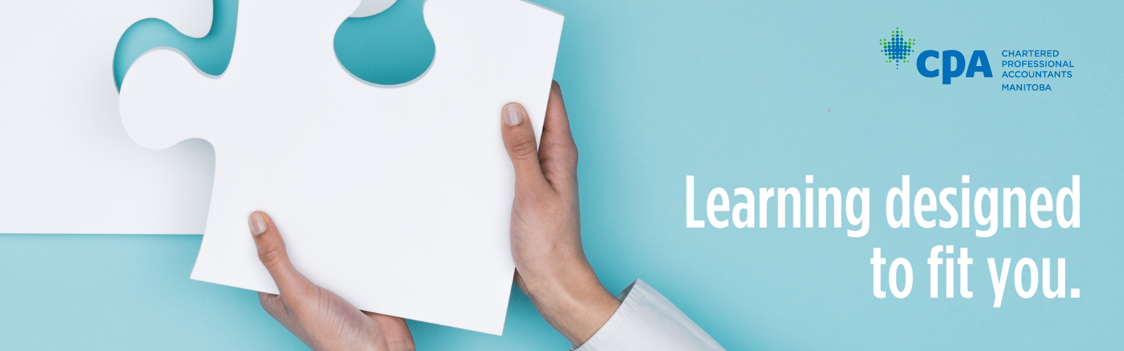 Hands hold a large white puzzle piece. Beside it are the words Learning designed 