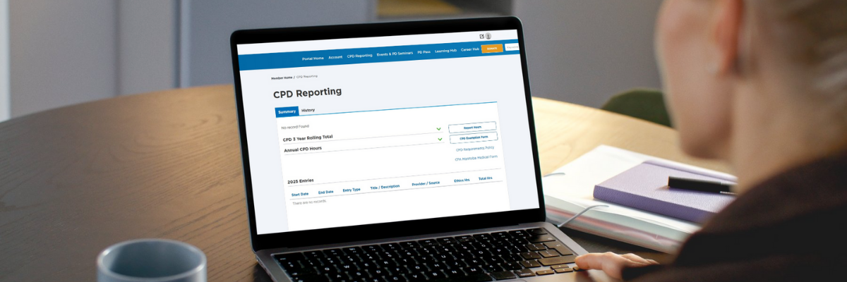 A woman looking at the CPD reporting webpage on her laptop.
