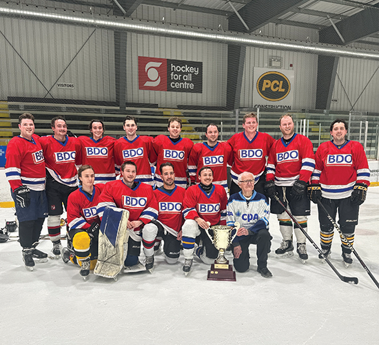 2026 A-side Winners - BDO team posing for a photo with the trophy.
