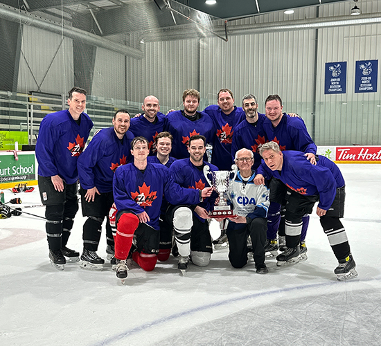2026 B-side winners - Canada Life team posing for a photo with the trophy.