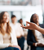 A person presenting to an audience.